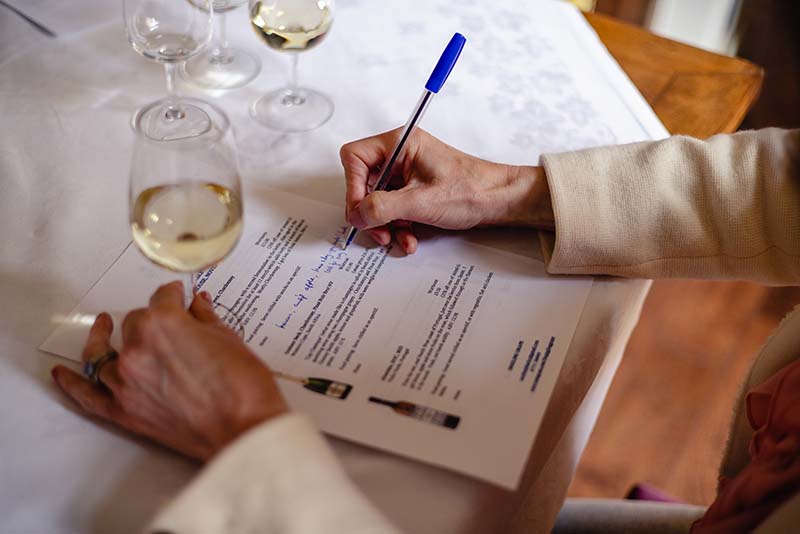 a wine student making notes on a wine course in somerset